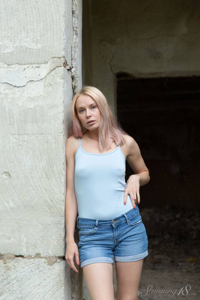 Blonde teen Maria Rubio strips down to her running shoes by a ruined dwelling - #14