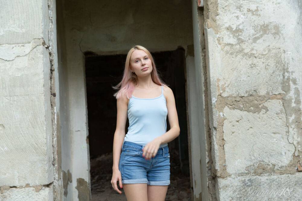 Blonde teen Maria Rubio strips down to her running shoes by a ruined dwelling - #5