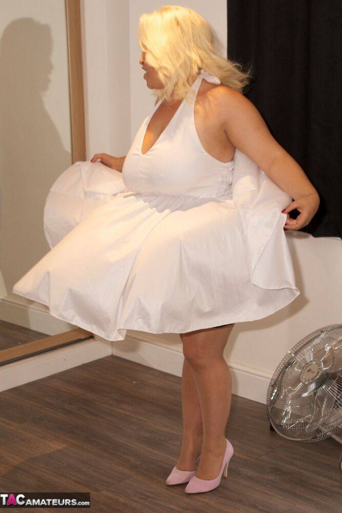 Obese platinum blonde woman reenacts a classic Marilyn Monroe scene - #9