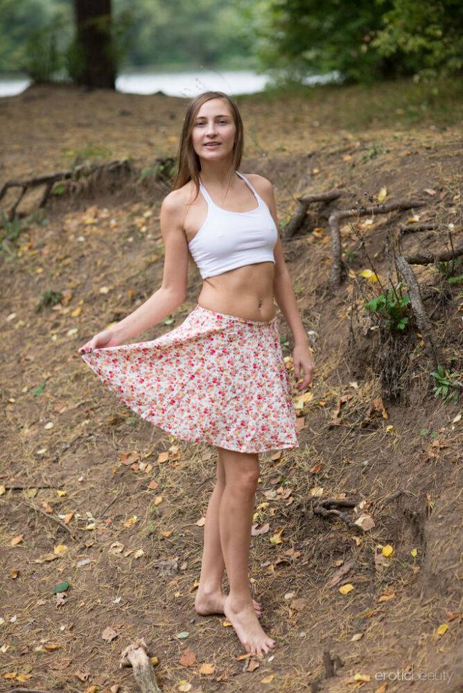 Nice teen Alexandra F gets completely naked while in a forest - #10