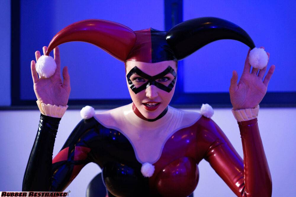 Solo model Harley Quinn poses for a non nude shoot in a costume made of latex - #2