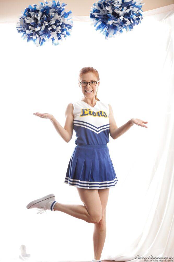 Cute redhead cheerleader Penny Pax in glasses baring big tits & firm ass - #15