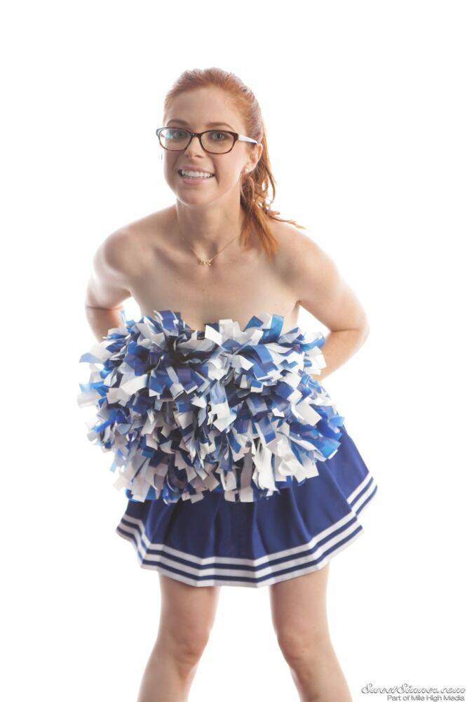 Cute redhead cheerleader Penny Pax in glasses baring big tits & firm ass - #8