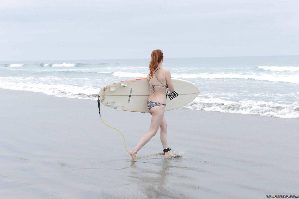Ginger girl with large ass Penny is showing her skills on the beach - #10