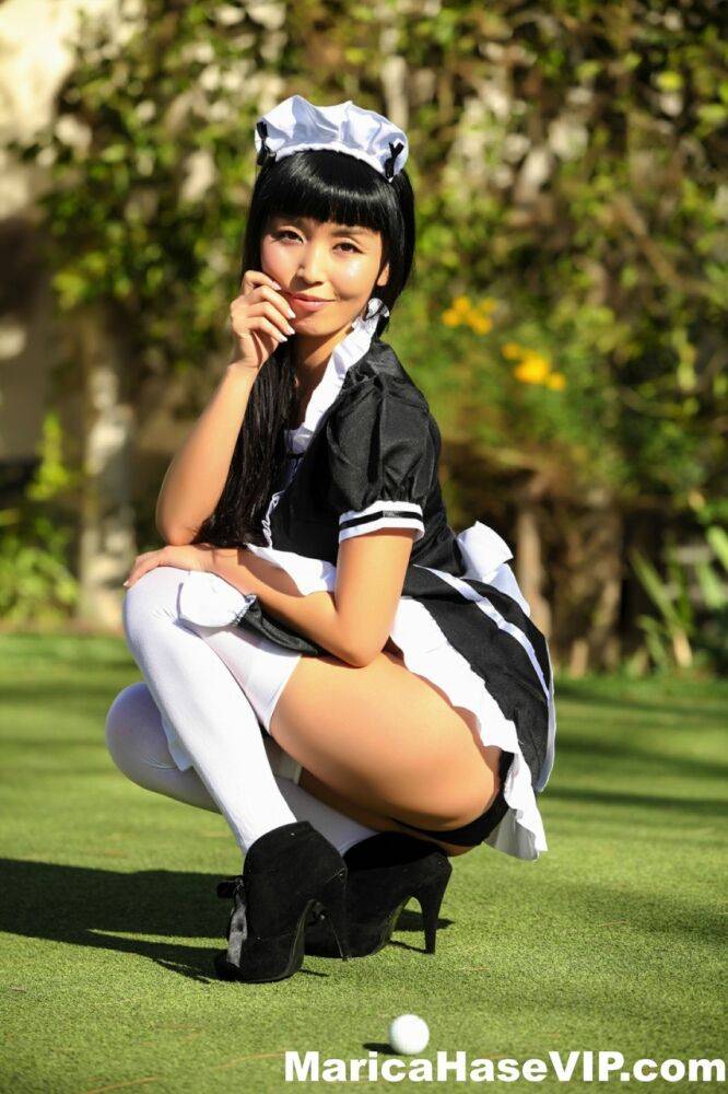 Japanese maid Marica Hase exposes her tits and twat on a putting green - #9