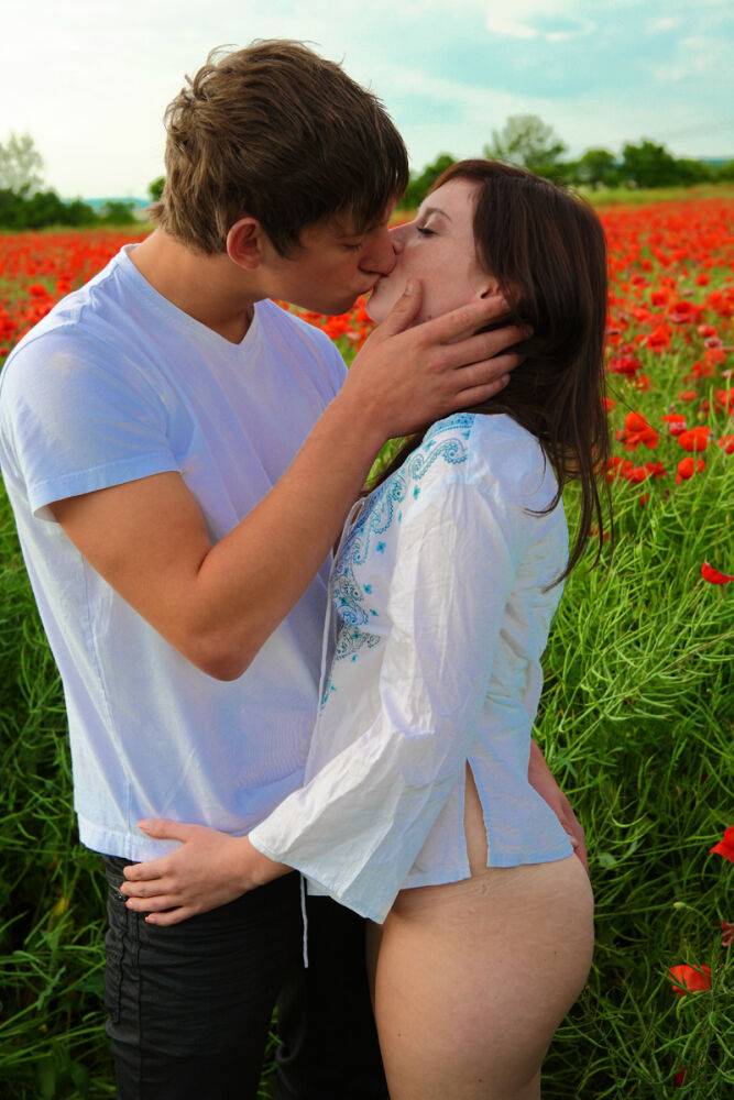 Young couple engages in hardcore sex while in a field of poppies - #10