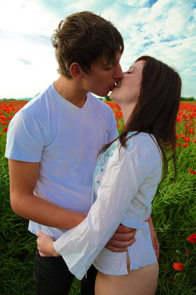 Young couple engages in hardcore sex while in a field of poppies - #2