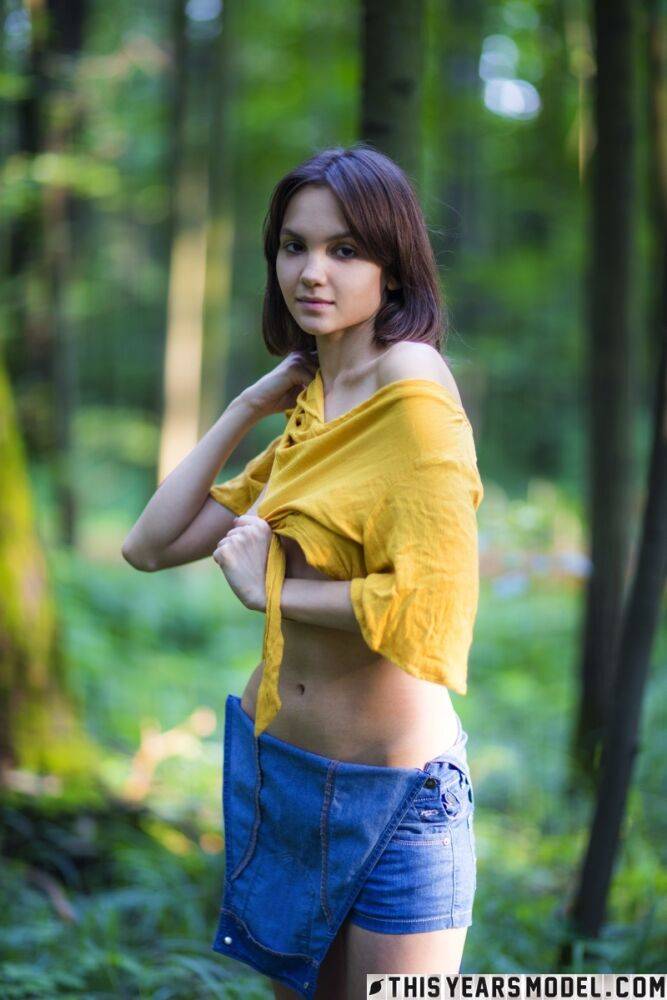 Skinny brunette Lara Masier gets completely naked in a mature forest - #12