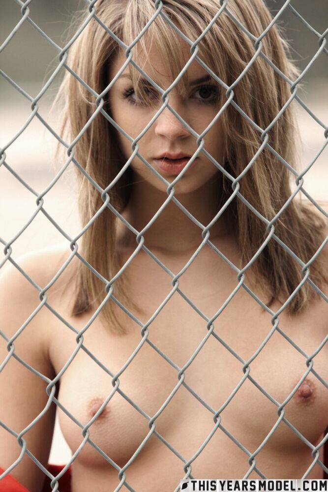 Pretty blonde Aspen Martin gets naked against a chain-link fence - #5