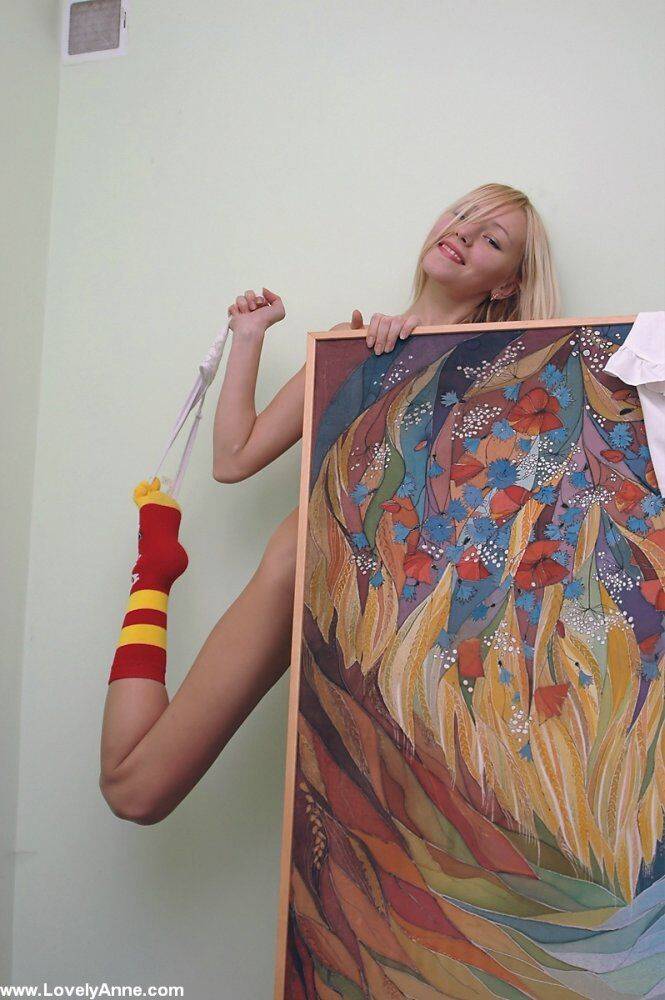 Charming blonde teen gets naked while wearing a pair of socks - #7