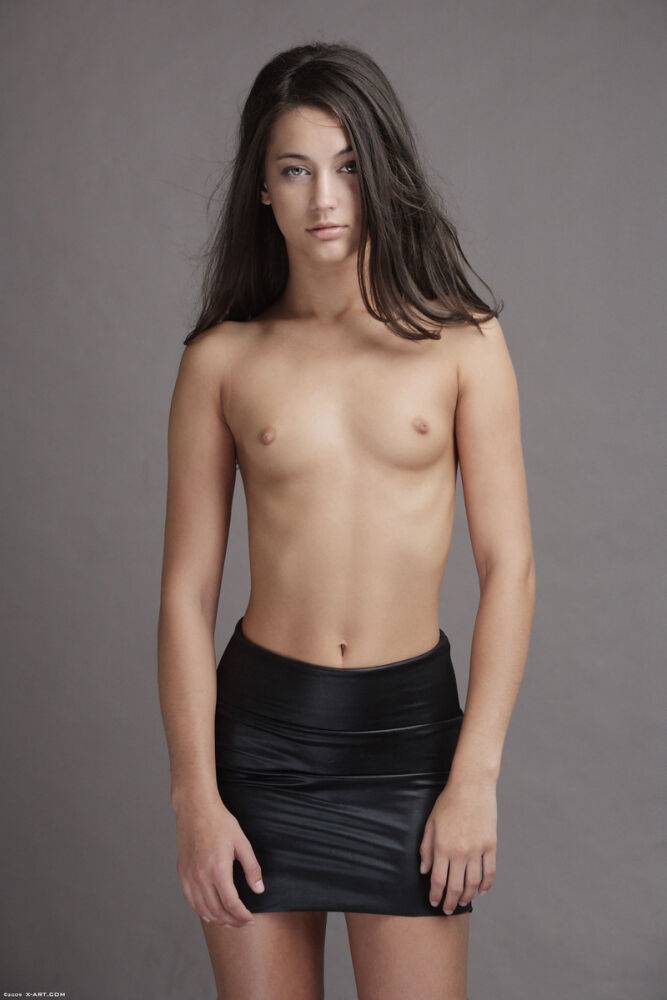 Slender Georgia poses with tiny tits bare before shedding her leather skirt - #5