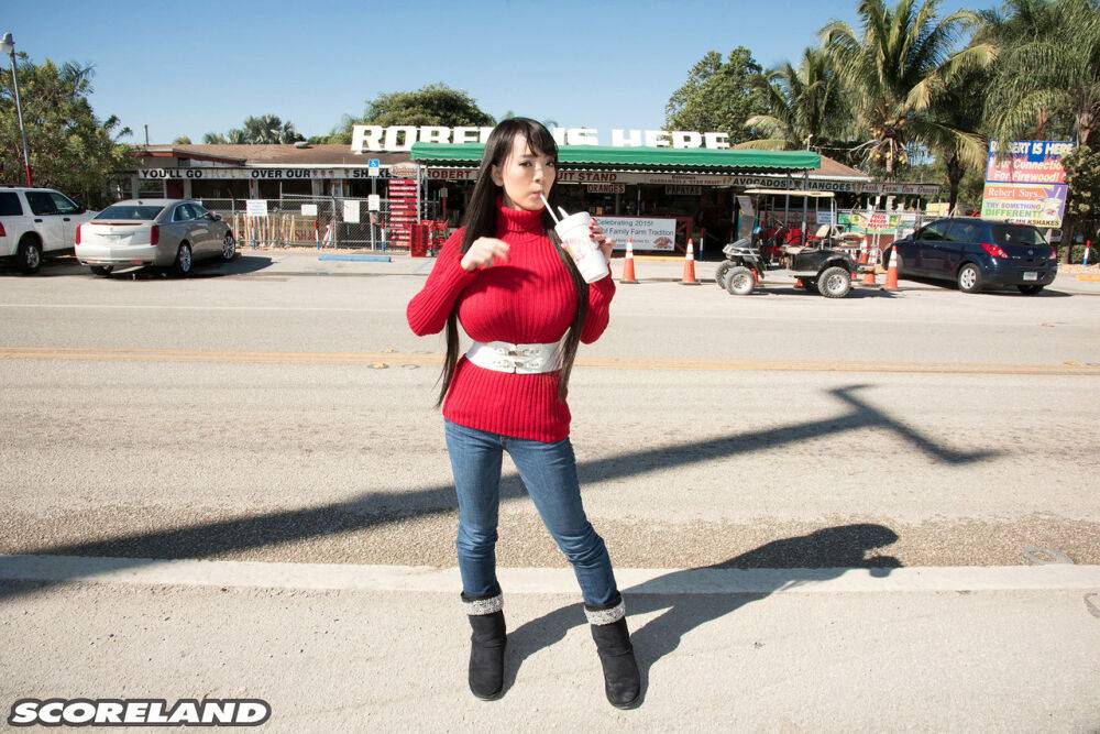 Asian girl with long hair Hitomi fills out her red sweater in non nude action - #1