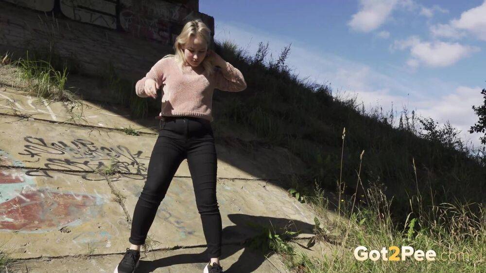 Blonde girl Nastya pulls down her pants for a badly needed pee in the outdoors - #1