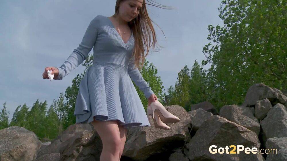 Barefoot girl Nastya squats for a piss on top of a bunch of boulders - #8