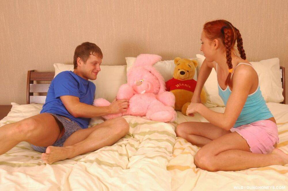 Young redhead in pigtails gets cum on face after sex amid her plush toys - #9