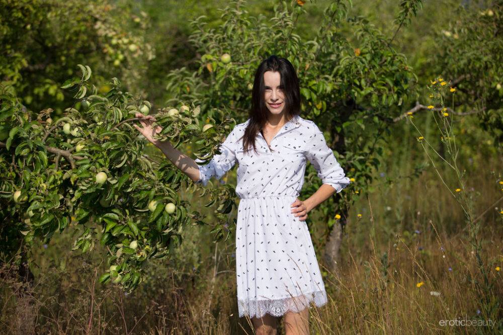 Dark haired teen Adel Morel picks apples and flowers in her birthday suit - #12