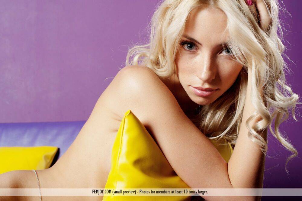 Thin blonde Adele P poses totally nude on a sofa in a tempting manner - #6