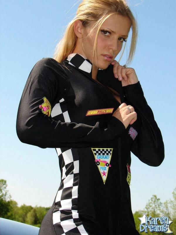 Amateur girl Karen shows some side boob in a racing suit atop a car - #7