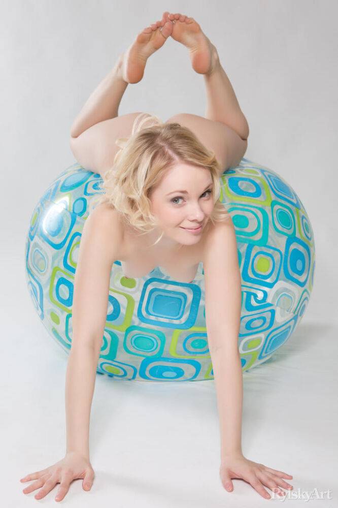 Adorable teen Feeona poses completely naked atop a medicine ball - #16