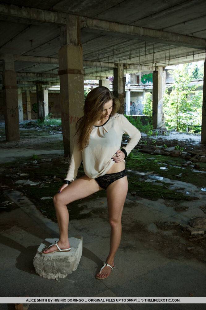 Teen solo girl Alice Smith touches her shaved pussy in an abandoned setting | Photo: 3412478
