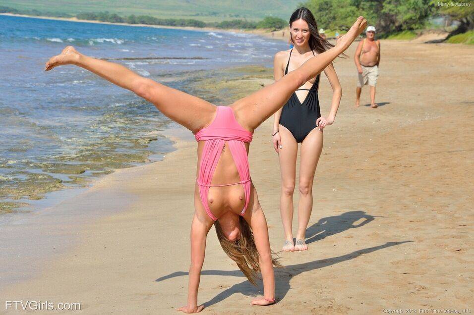 2 lesbians frolic in swimsuits at the beach before strolling in the nude - #13