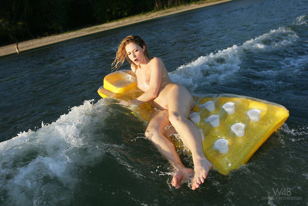 Topless girl Alissa White takes off her wet bikini bottoms on an air mattress - #14