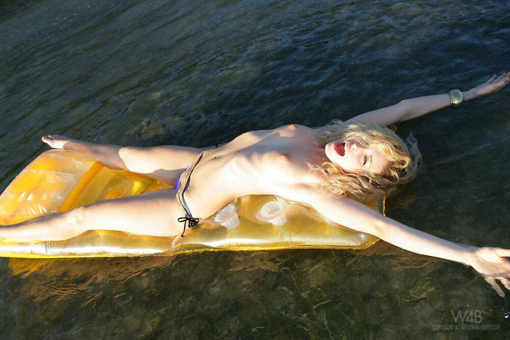 Topless girl Alissa White takes off her wet bikini bottoms on an air mattress - #16