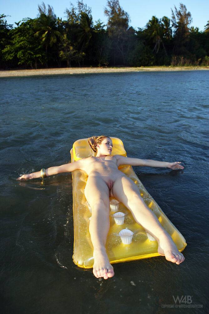 Topless girl Alissa White takes off her wet bikini bottoms on an air mattress - #10