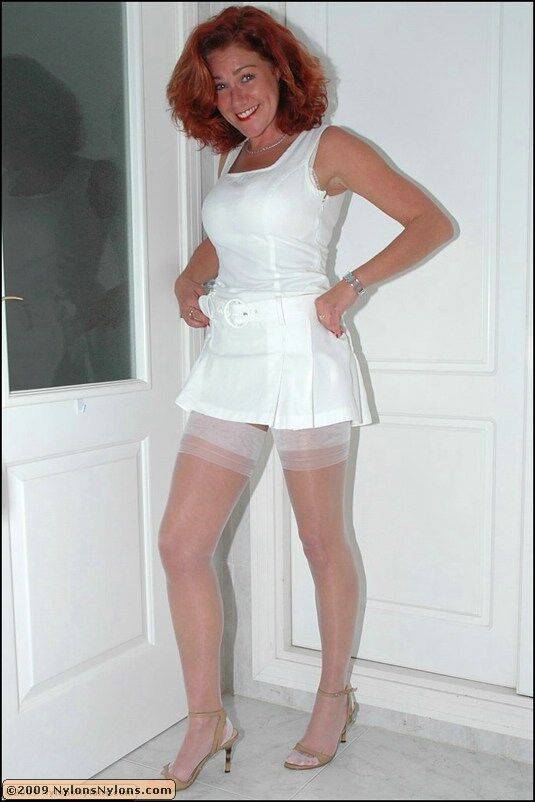 Adorable mature woman posing in white lingerie and shiny seamed stockings - #12