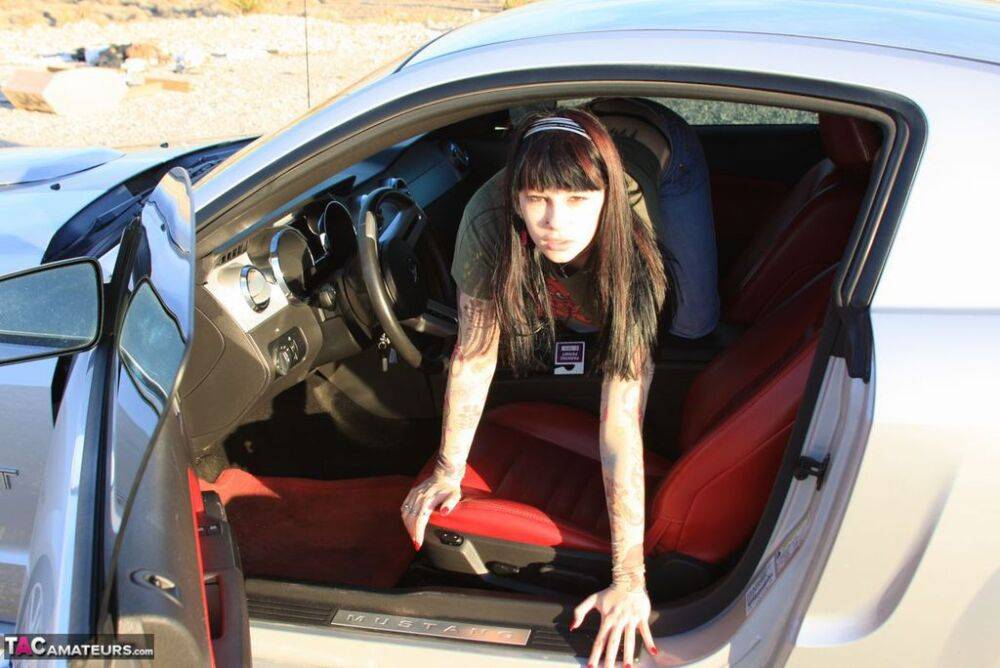 Brunette amateur Susy Rocks exposes her nice tits while inside a muscle car - #4