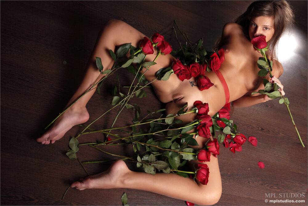 Glamour model gets totally naked while covered in long stem roses - #10