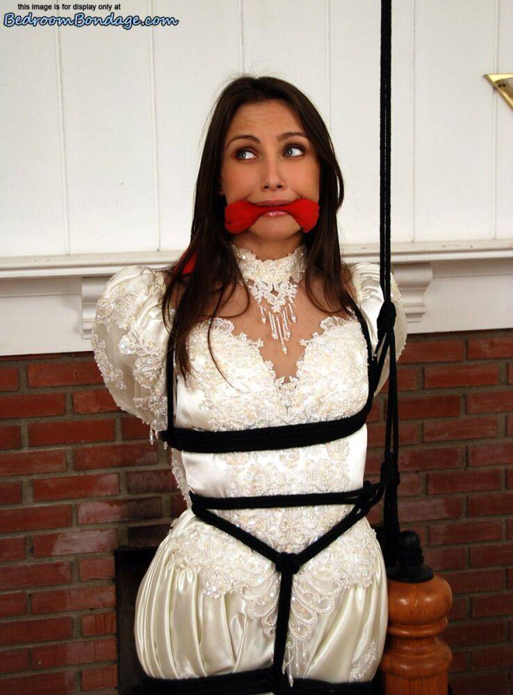 Brunette bride Celeste Star is ballgagged and tied up in her wedding dress - #6