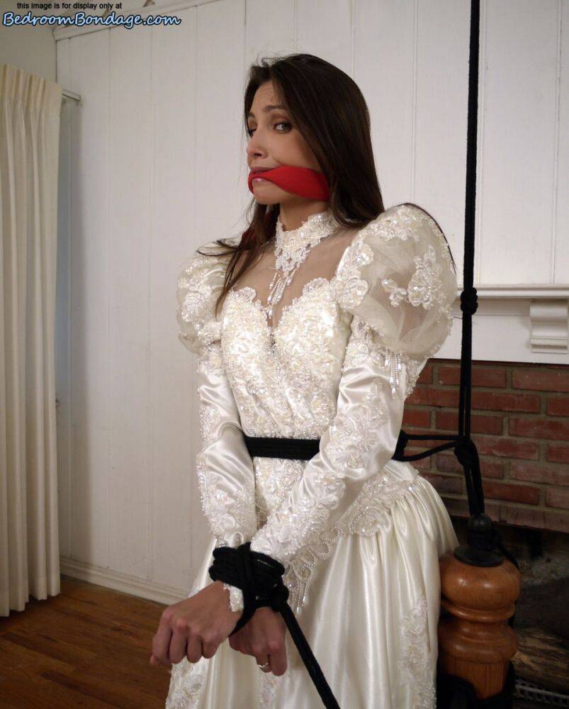 Brunette bride Celeste Star is ballgagged and tied up in her wedding dress - #13