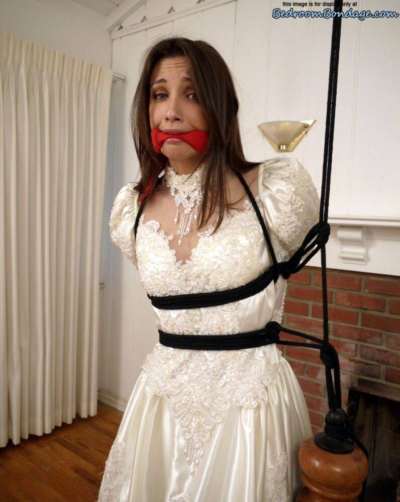 Brunette bride Celeste Star is ballgagged and tied up in her wedding dress - #7