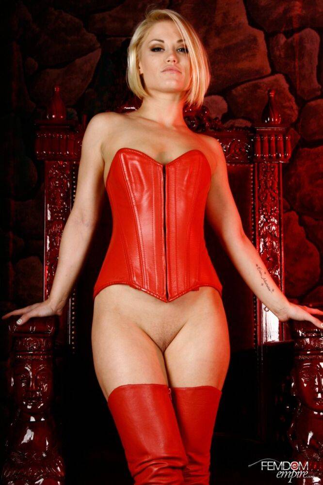 Hot blonde Ash Hollywood shows her bald cunt in a red corset and long boots - #13