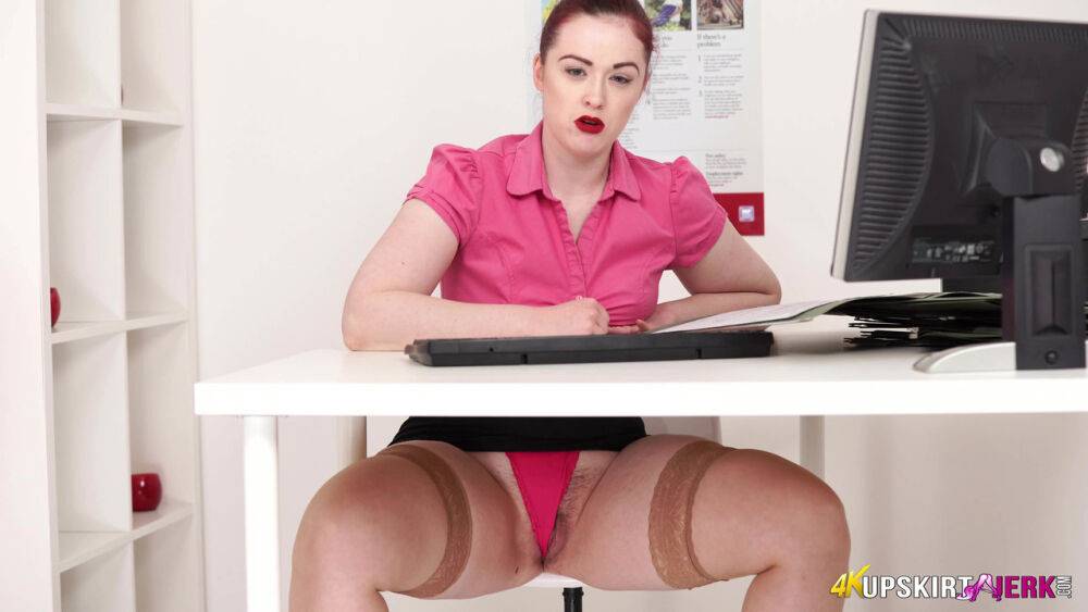 Pale redhead exposes her thong during upskirt action under a table - #7