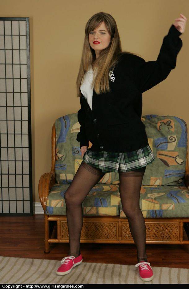 Naughty schoolgirl taking off her uniform and posing in lingerie - #7