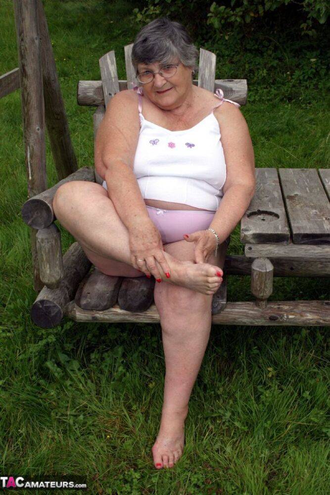 Old British woman Grandma Libby exposes her boobs on a backyard bench swing - #6