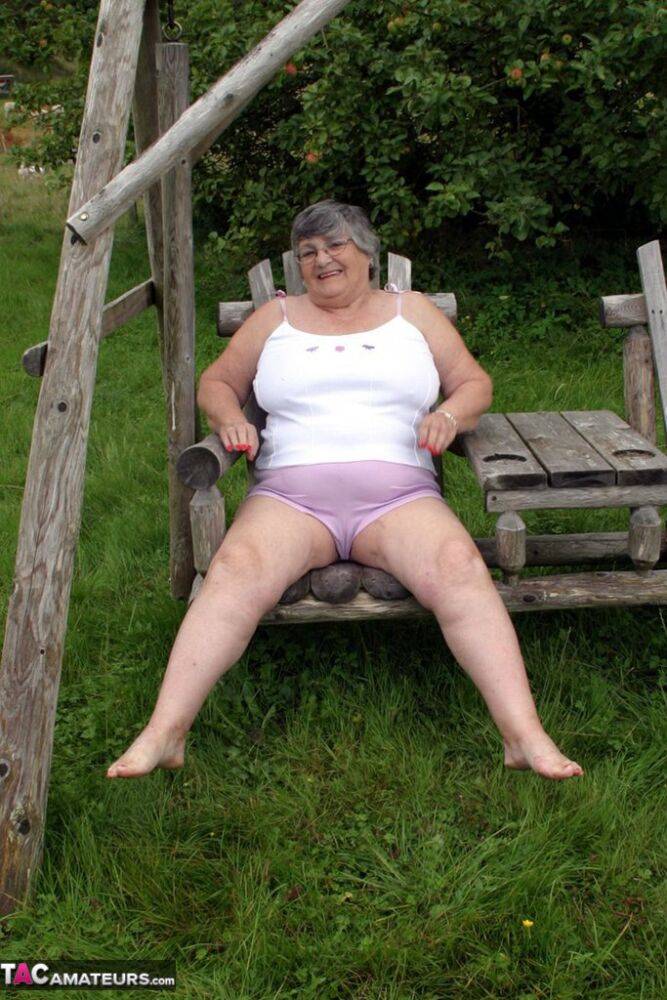 Old British woman Grandma Libby exposes her boobs on a backyard bench swing - #16