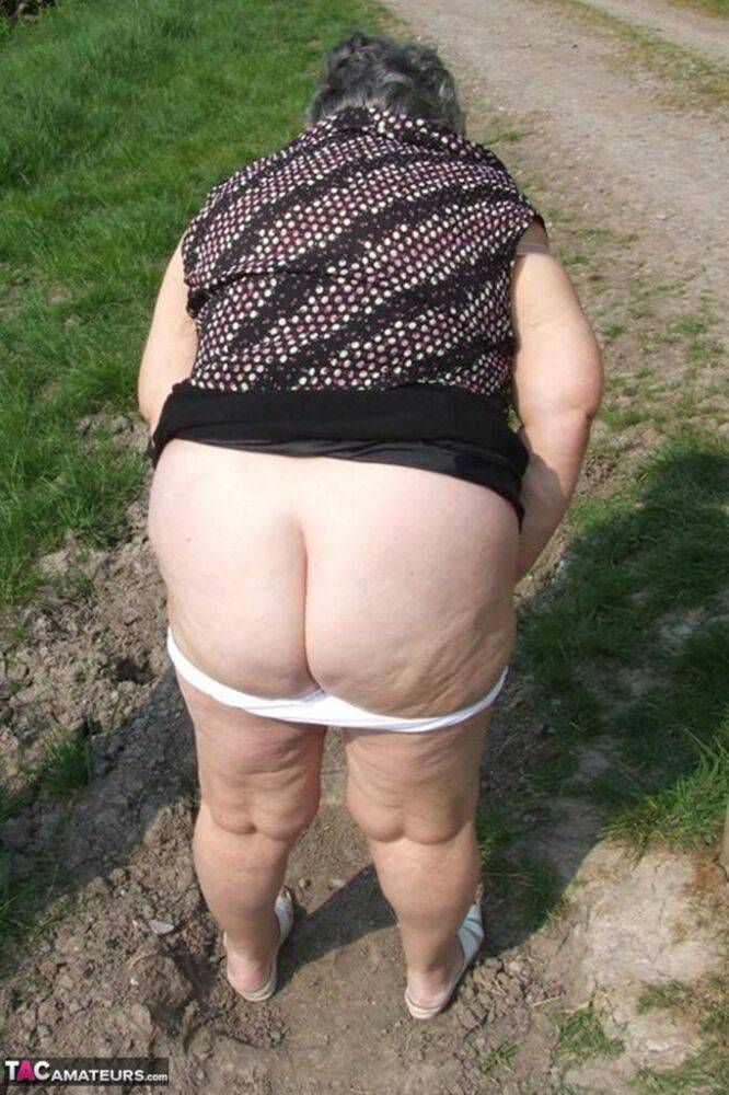 Horny granny Grandma Libby exposes massive big tits and huge ass at the farm - #11