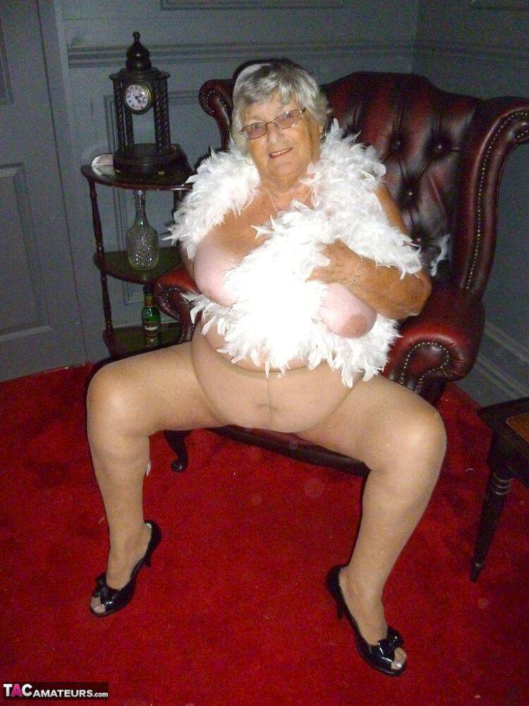 Fat nan Grandma Libby wears a feather boa while baring her saggy tits and butt - #15
