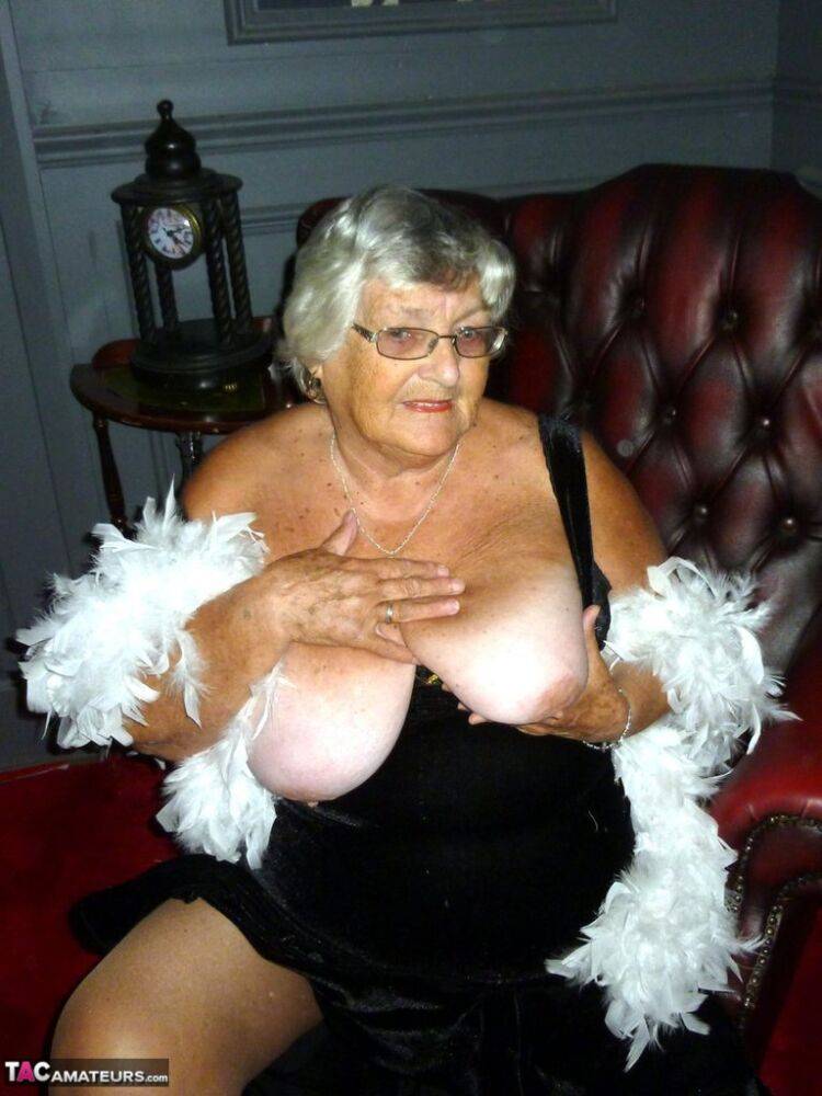 Fat nan Grandma Libby wears a feather boa while baring her saggy tits and butt - #9