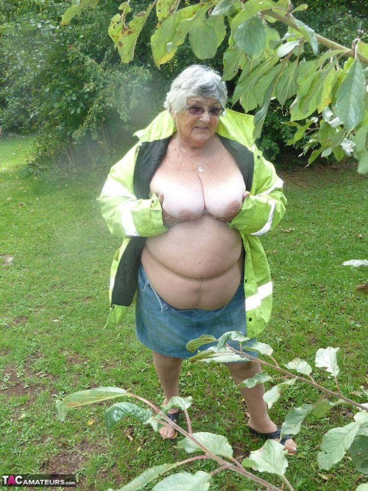 Fat British woman Grandma Libby exposes herself by a tree in a park - #2