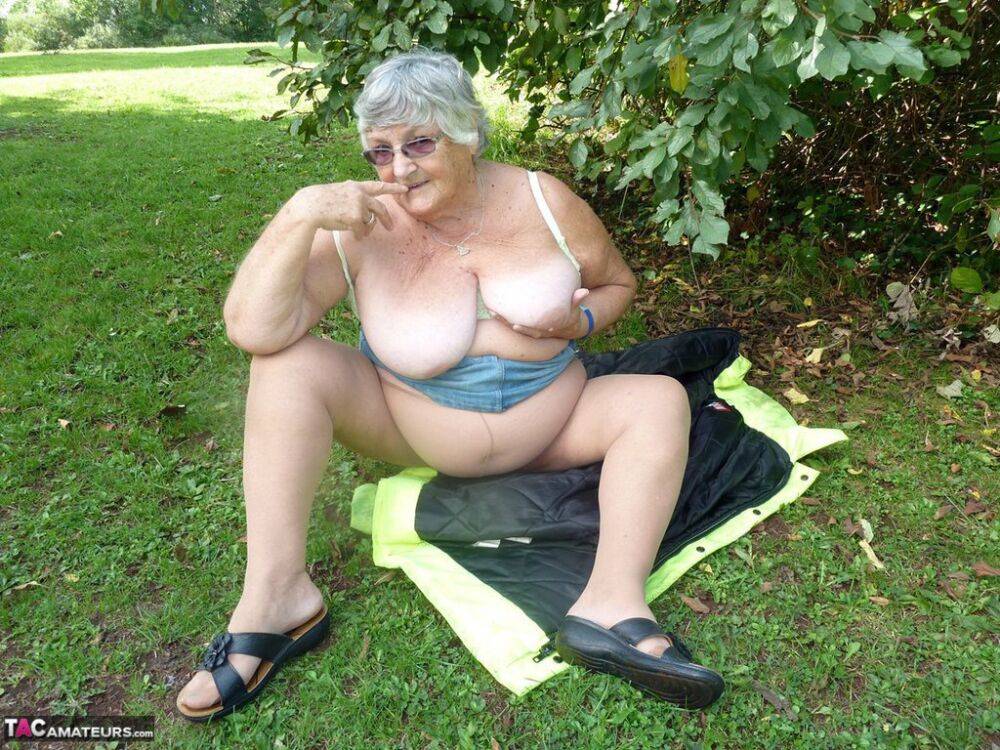 Fat British woman Grandma Libby exposes herself by a tree in a park - #10