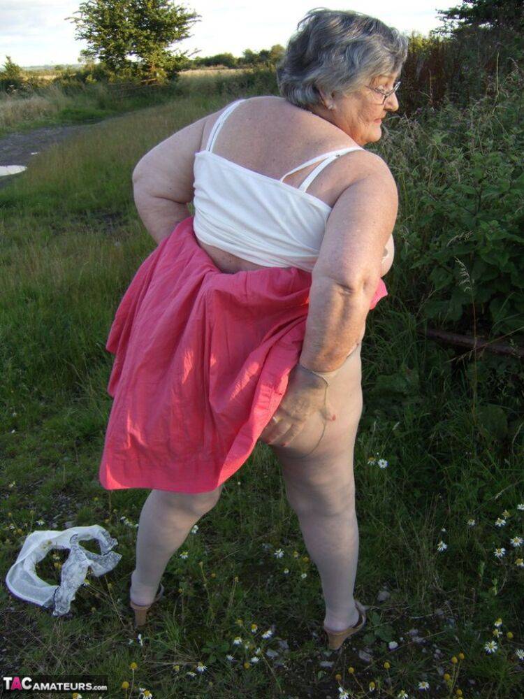 Obese oma Grandma Libby exposes her huge ass while in a field by a rural road - #16