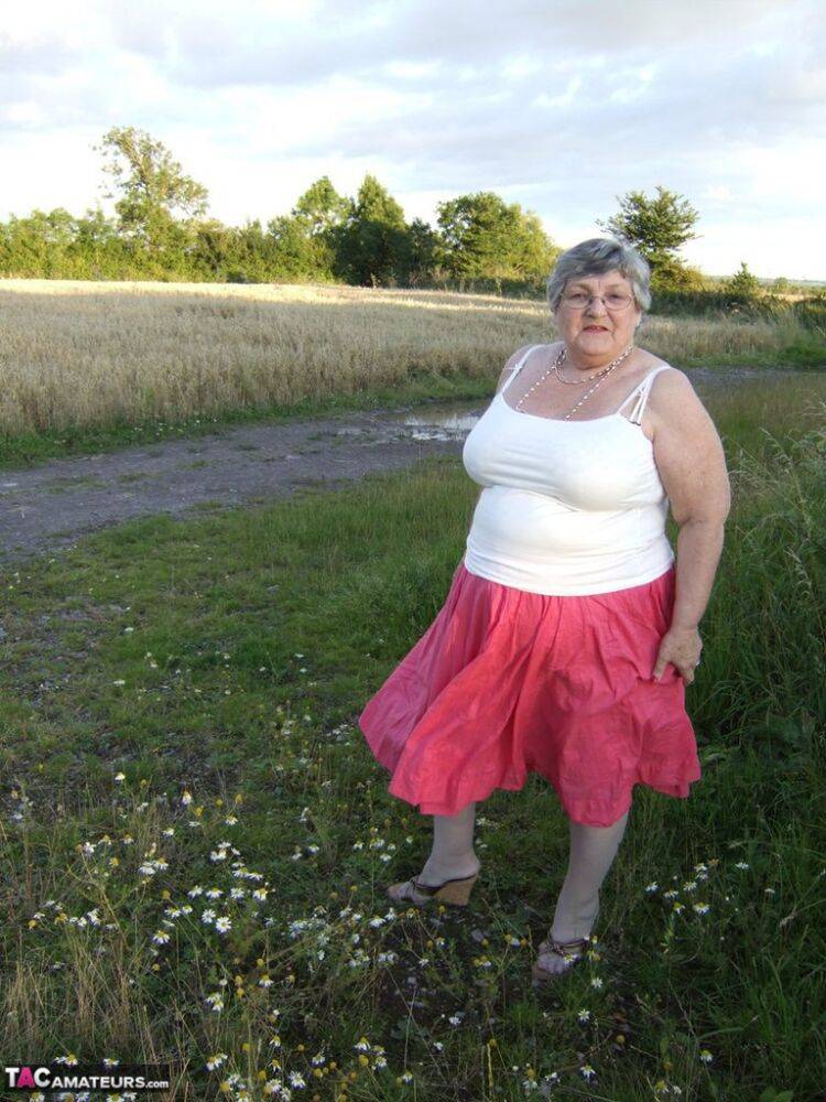 Obese oma Grandma Libby exposes her huge ass while in a field by a rural road - #11