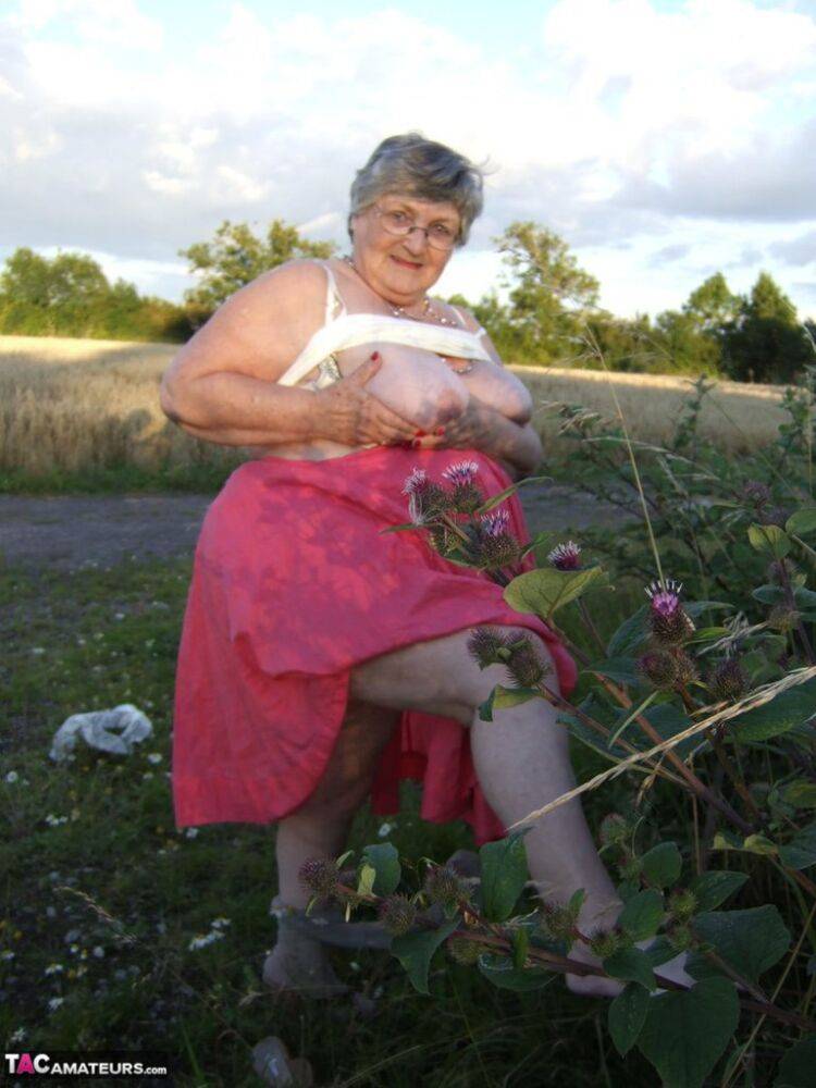 Obese oma Grandma Libby exposes her huge ass while in a field by a rural road - #15