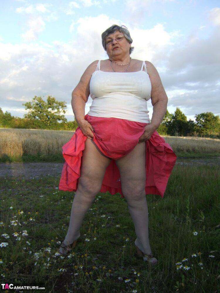 Obese oma Grandma Libby exposes her huge ass while in a field by a rural road - #12