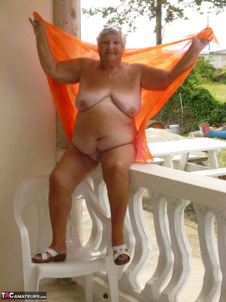 Fat oma Grandma Libby exposes her tan lined body on a balcony - #12