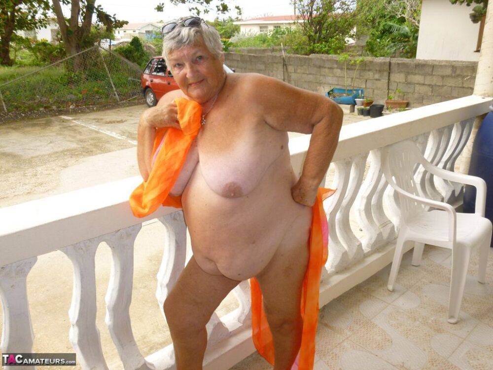 Fat oma Grandma Libby exposes her tan lined body on a balcony - #4